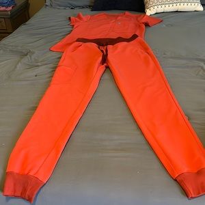 FIGS scrubs set. Salmon color. Great condition. Like New. Jogger pant style.